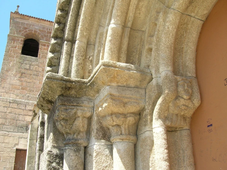 an intricate carving of some people's faces in a building