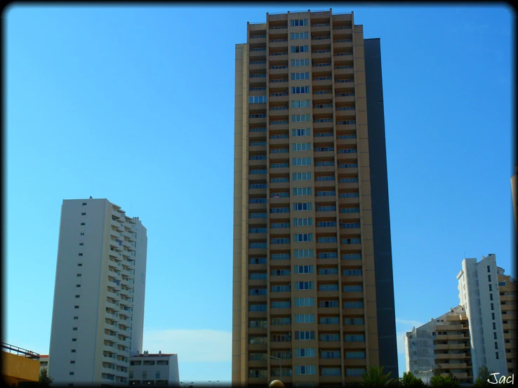 tall buildings in a city with a blue sky