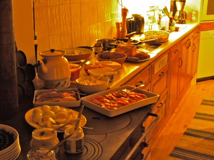 a counter topped with different dishes of food