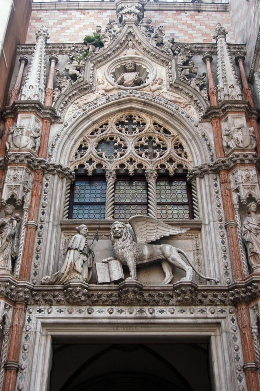 a fancy building with a large metal horse on the wall