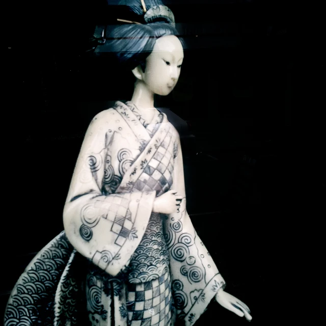 an asian woman dressed in oriental dress, holding a fan