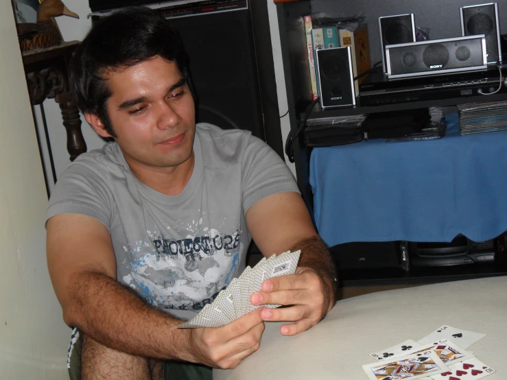 a man playing a card game at the table