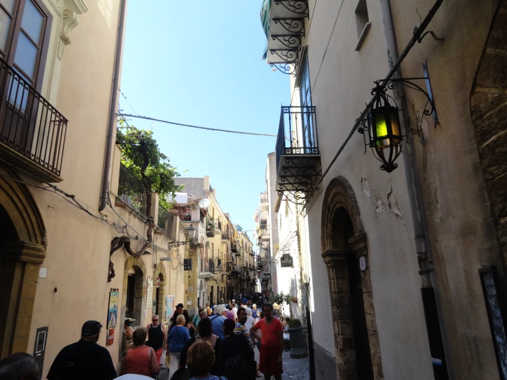 a crowd of people that are walking down some streets