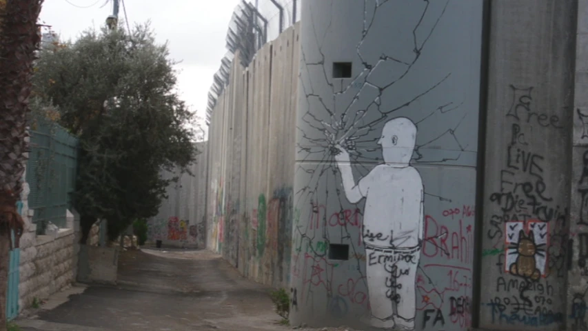 a street is lined with graffiti on the walls