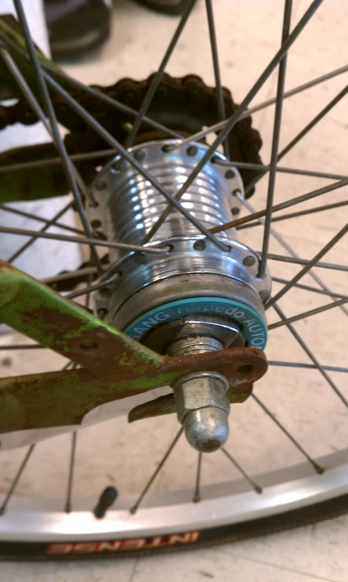 the front wheel of a bike with spokes