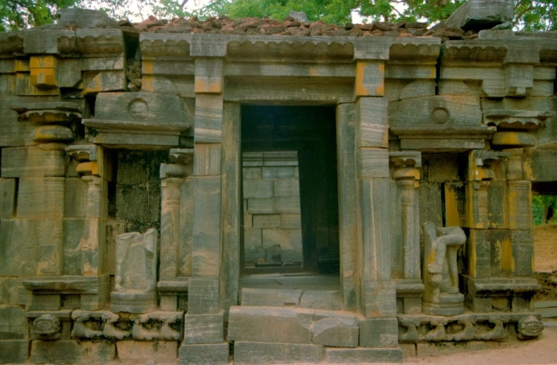 an intricate doorway with two elephants in it