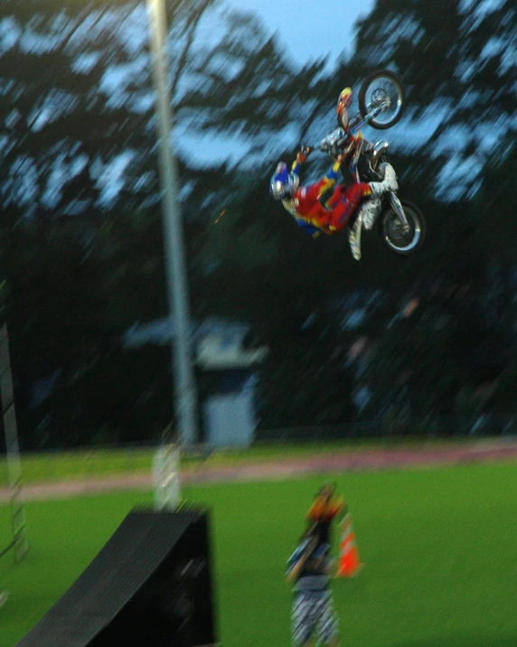 a man on a bike is in mid air