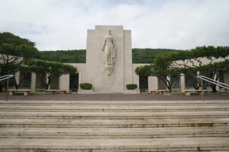 stairs lead up to a tall stone statue