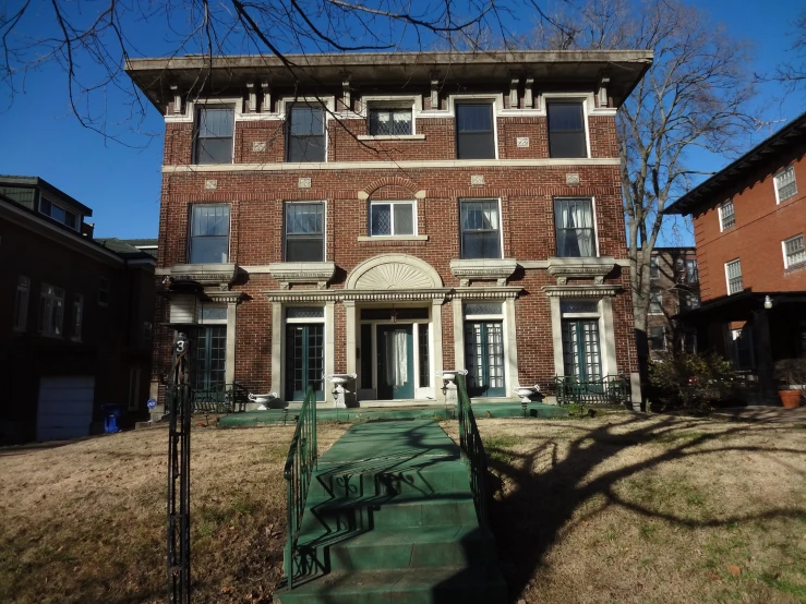 an older style brick building with many windows