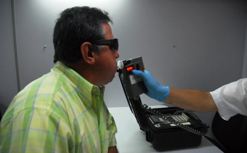 a doctor examines the back of a patient