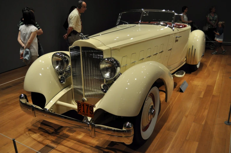 a very nice looking old car in a museum
