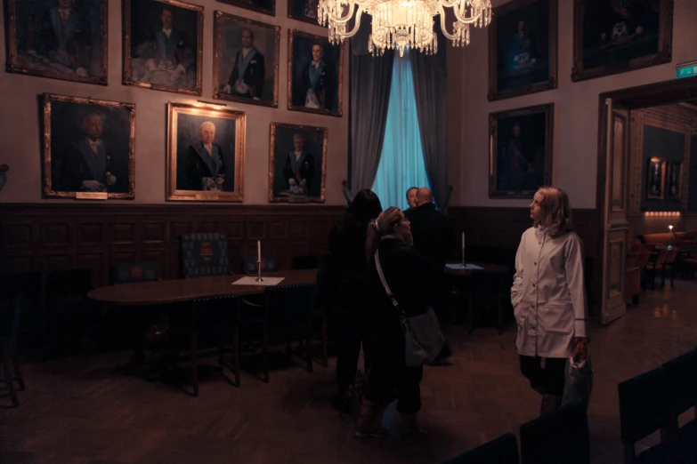 a group of people standing inside of a room