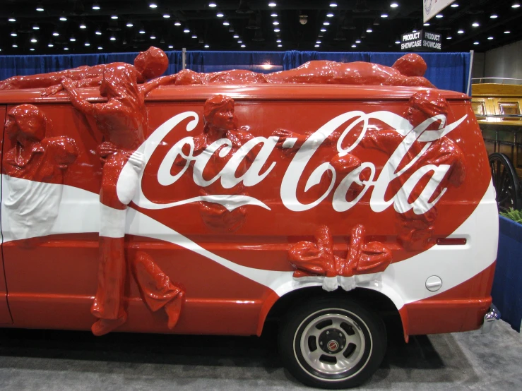 an advertit for a soda cola bus with it's door open