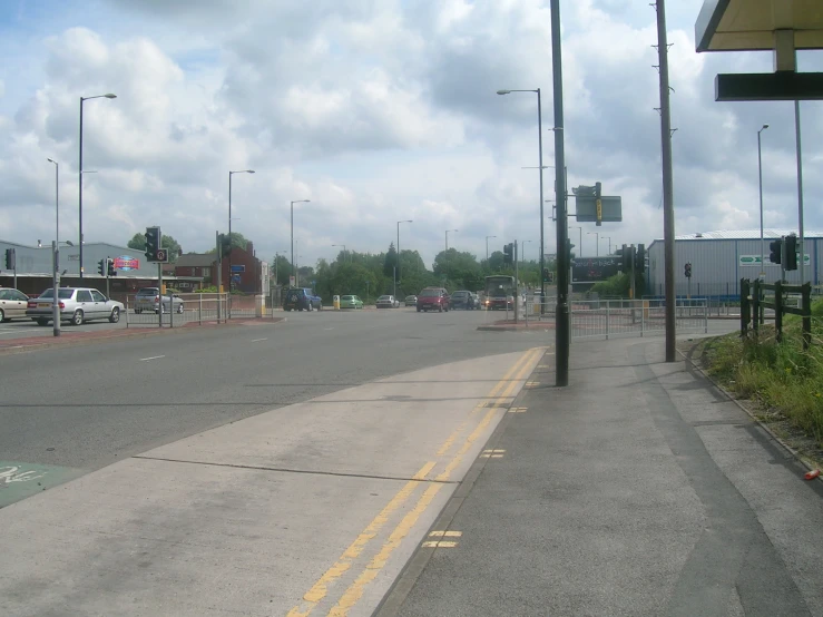 a city road has cars on it and no traffic