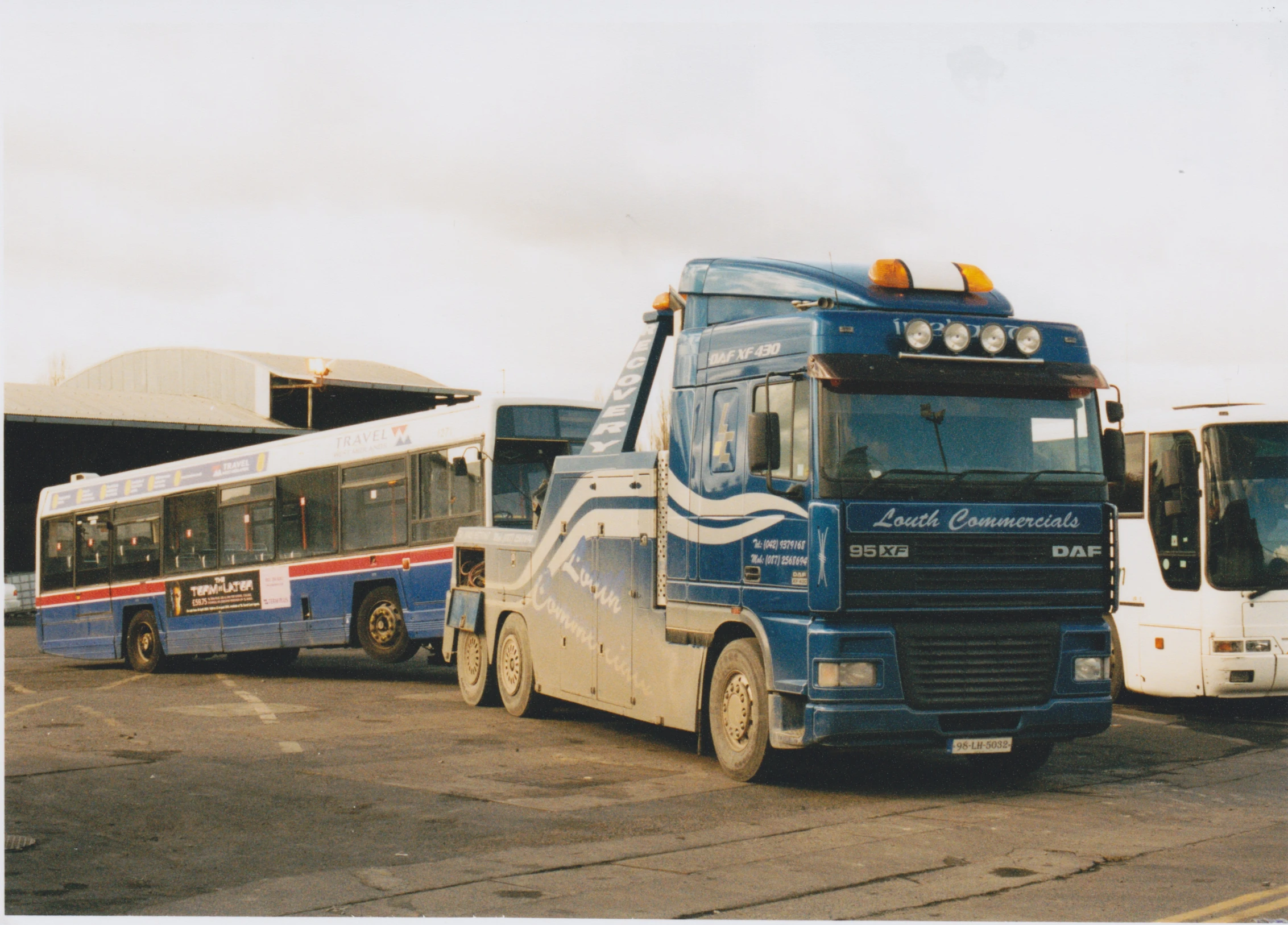 a number of buses parked near each other