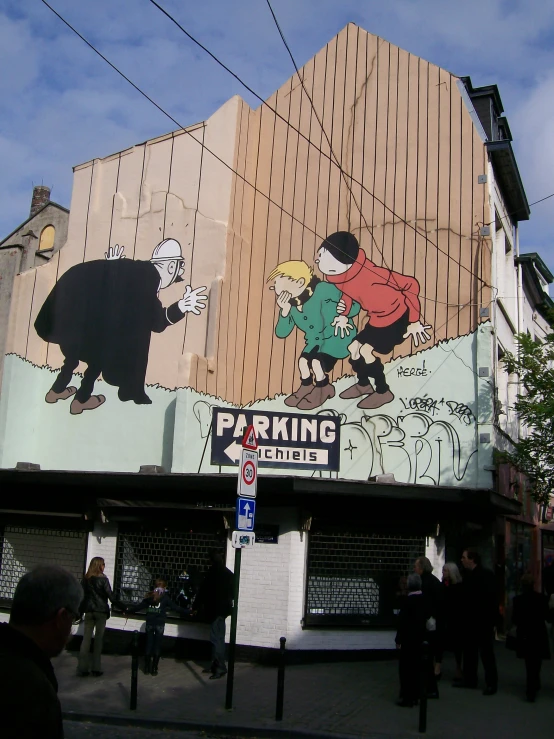 people walk near an advertising for a bar