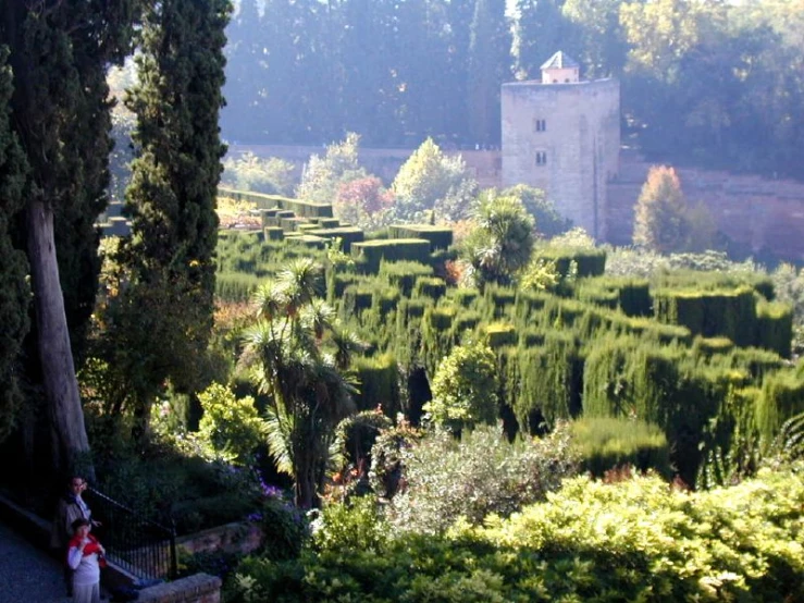 a scenic view of an old mansion from the street