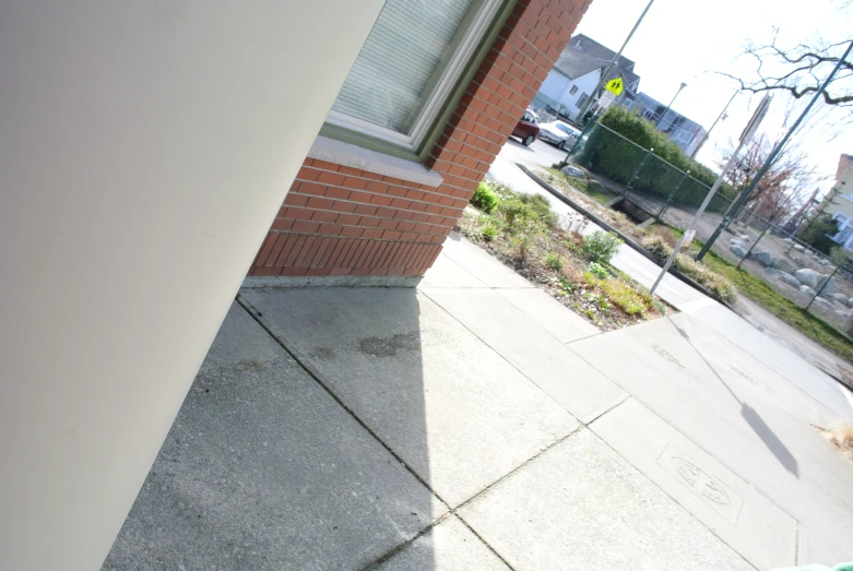 a corner view of a house next to a building