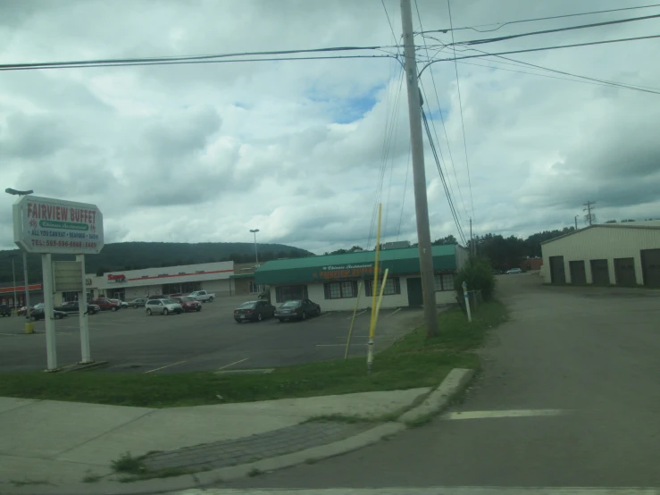 cars are parked outside of a large shopping center