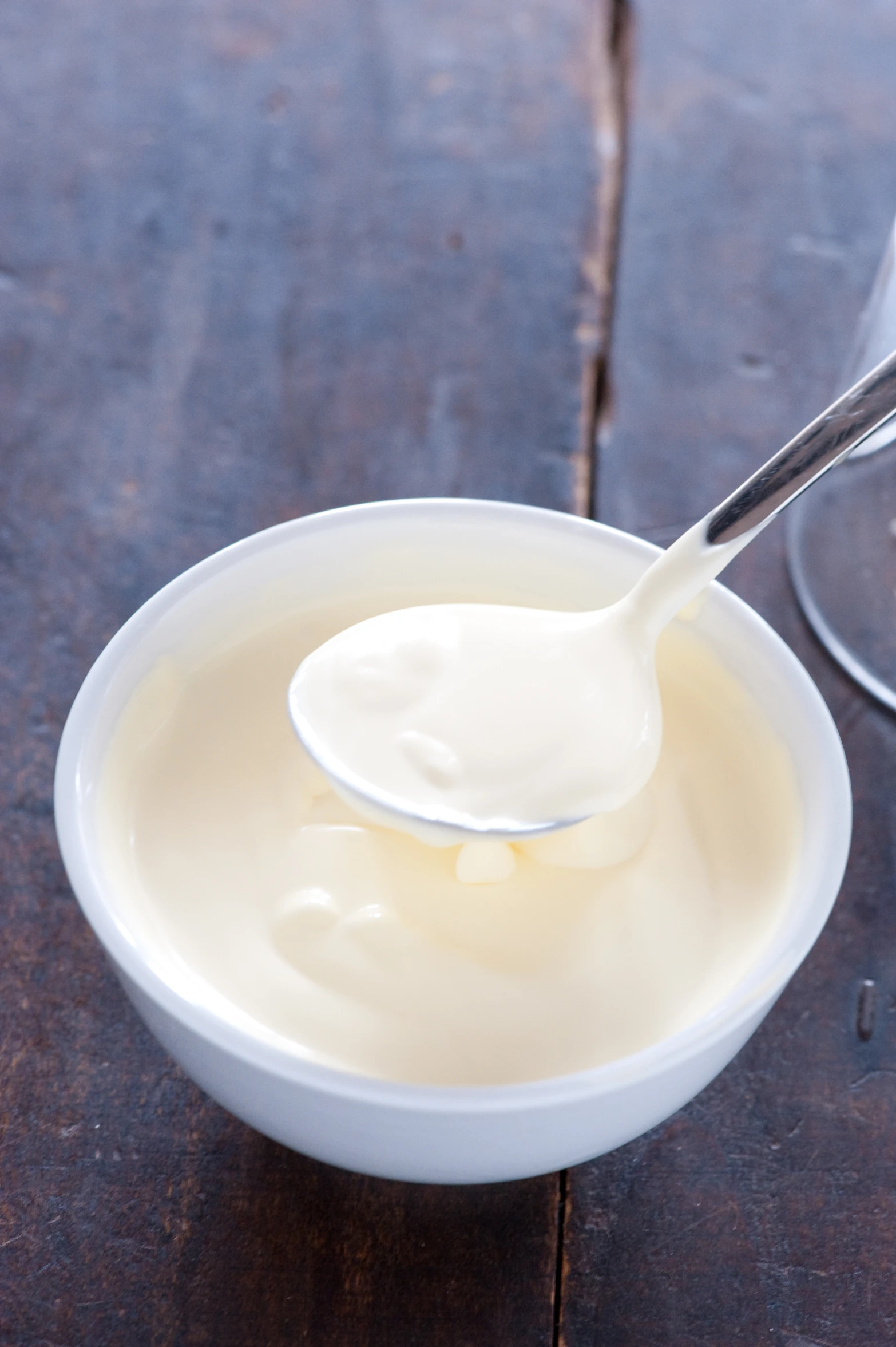 a small bowl of yogurt and a spoon