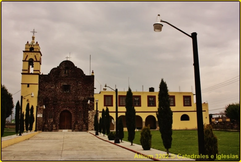 a large building has an old clock tower on it