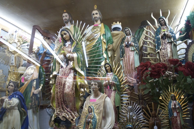 the statues of mary and jesus are all surrounded by decorations