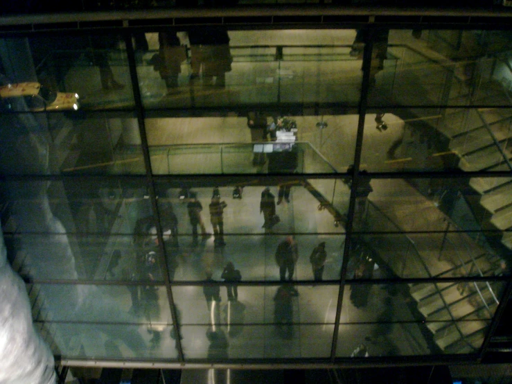 many people walking along stairs in a building