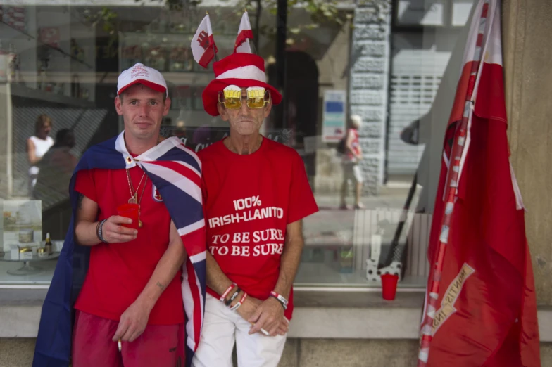 two people in red shirts standing next to each other