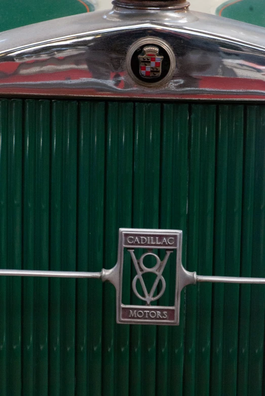 closeup view of the emblem on an old car