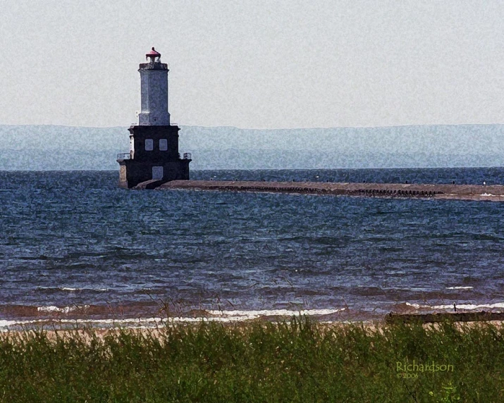 a lighthouse sits in the middle of the water