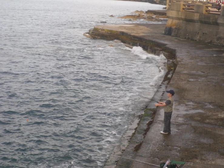 an individual on the waterfront looking out at the water