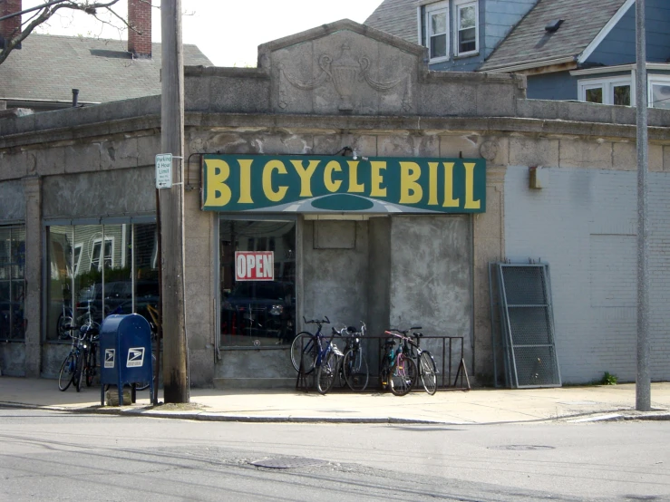 a bicycle shop sitting next to each other on a street