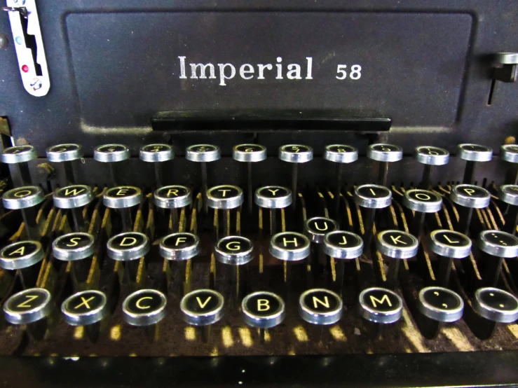 an old fashioned typewriter with metal letters