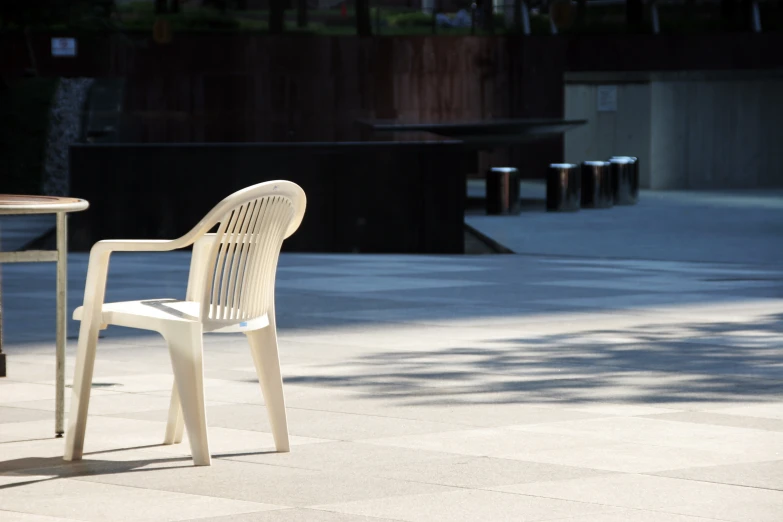 a white table with two chairs next to it