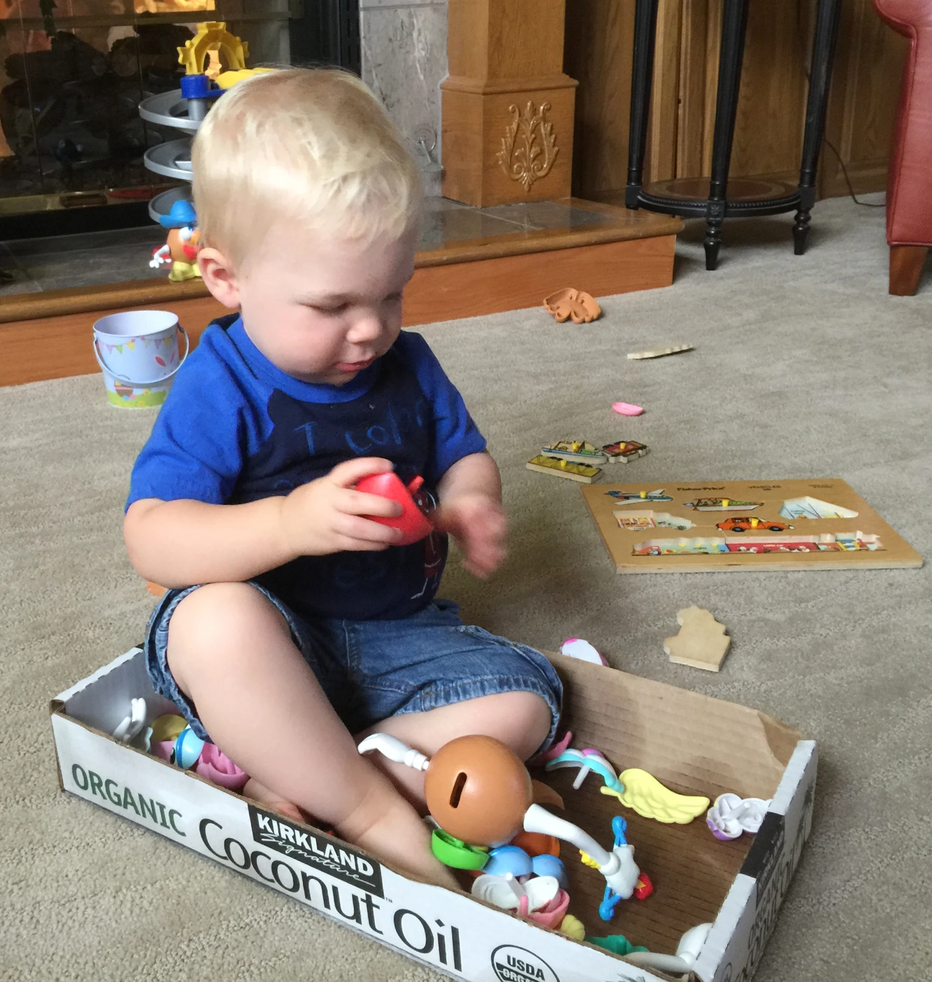 a child playing with an assortment of toys