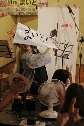 an oriental woman is holding a sign with writing