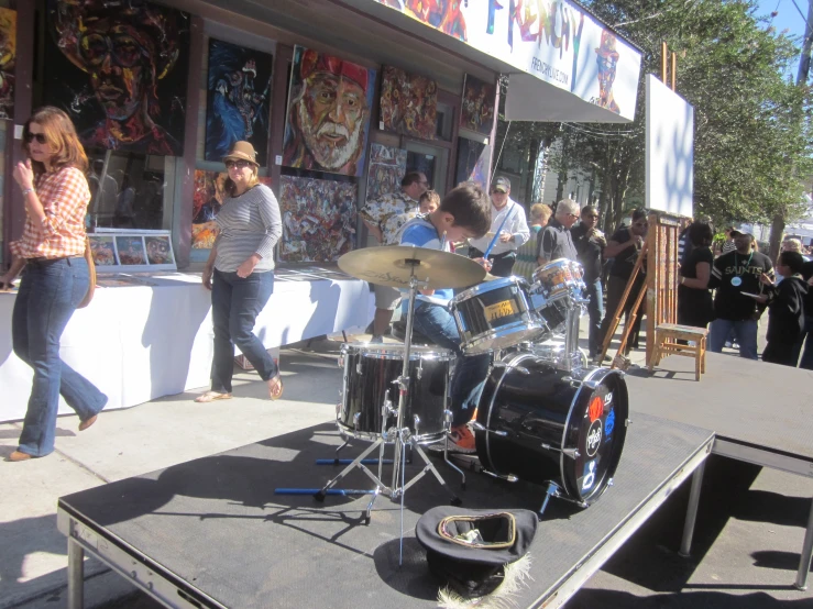 the group plays music in front of the shop