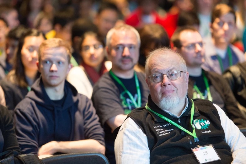 some very cute looking people at a conference