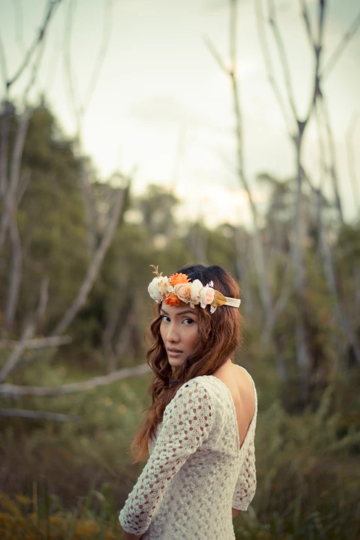 an image of a woman wearing a flower crown