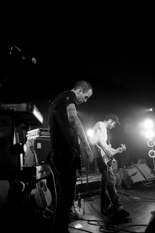 a couple of men standing on top of a stage