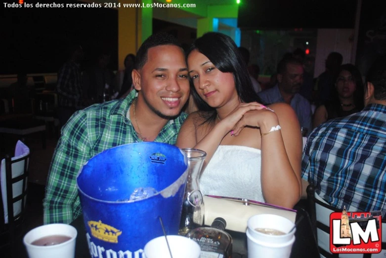 a man sitting next to a woman at a table