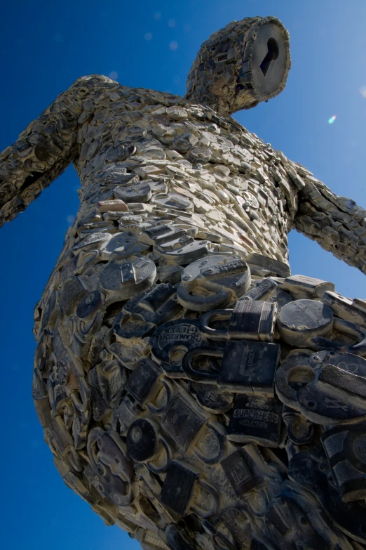 a close up image of a statue made out of many old tires