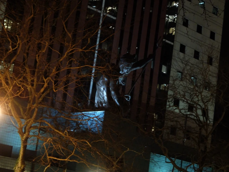 a statue of a cat on top of a building