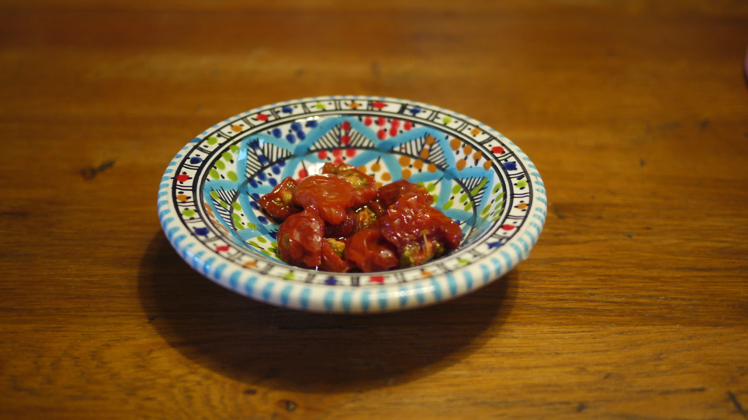 a small bowl filled with a red sauce