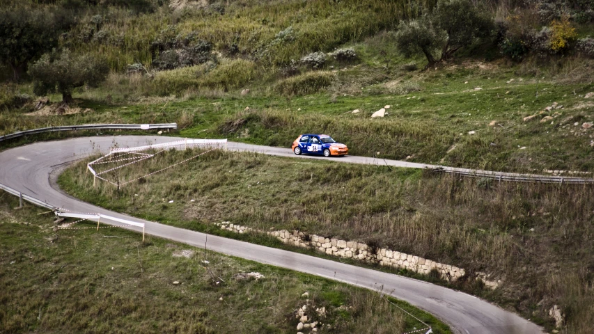 an image of a car on the road going around curve