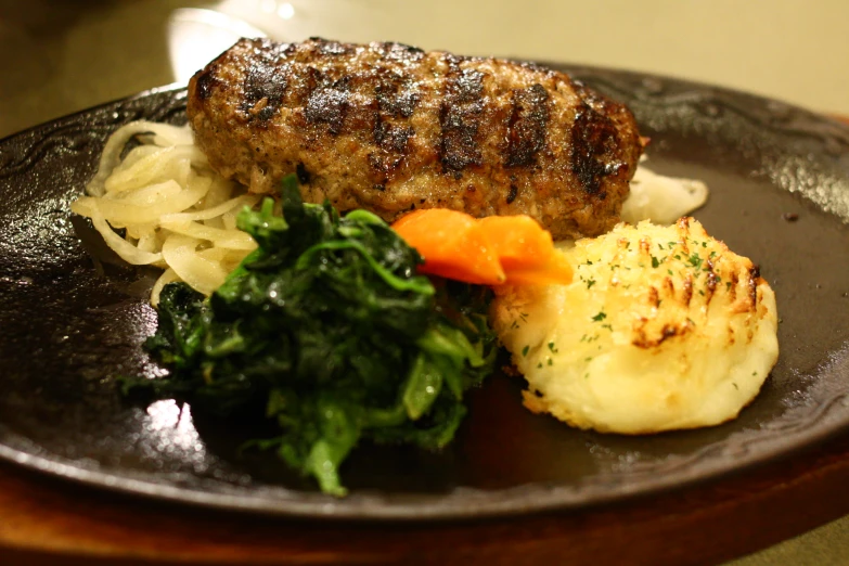 steak, cauliflower and broccoli are on a plate