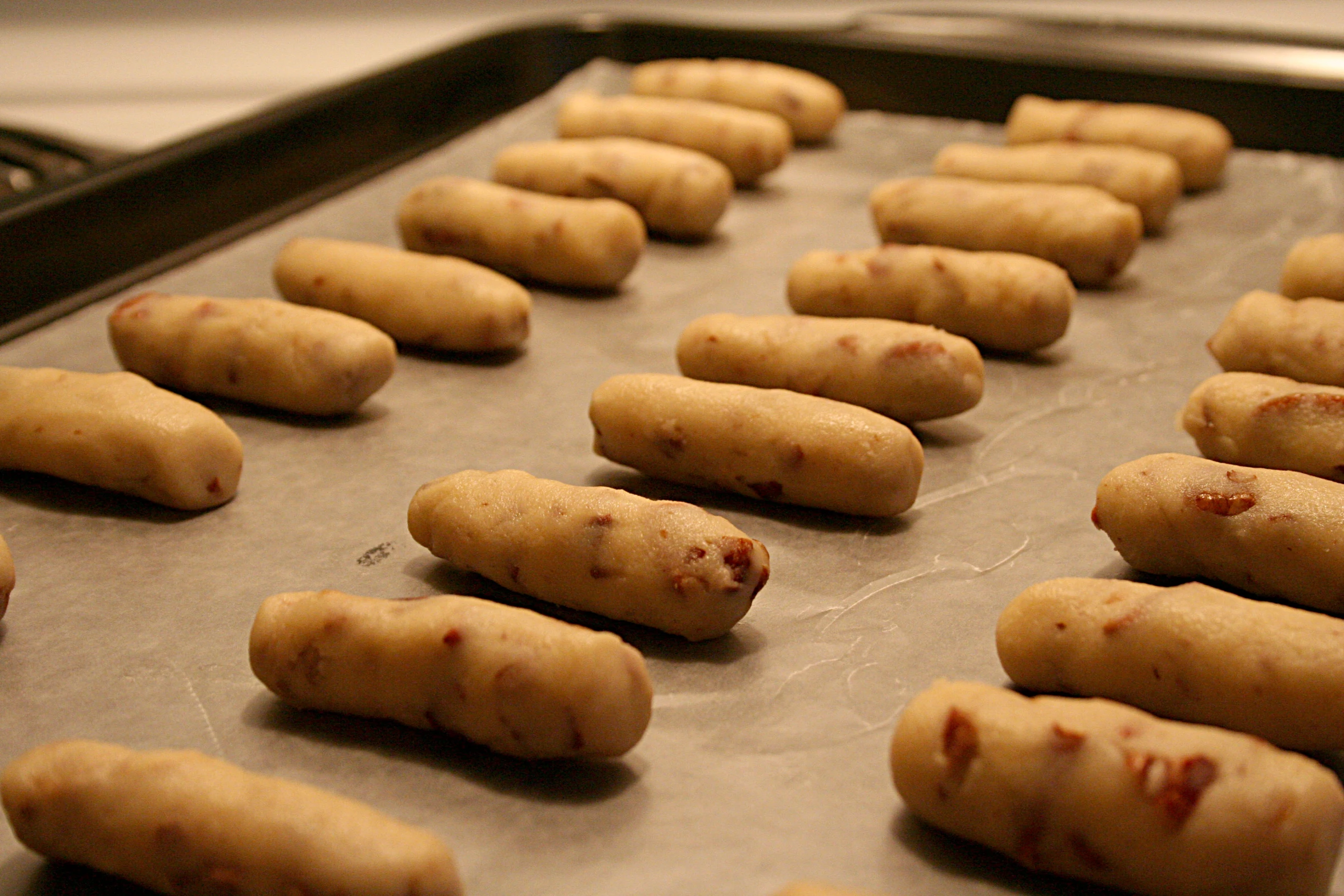 freshly baked cookies lay on a baking sheet