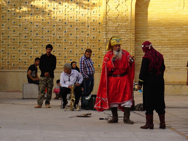 a man dressed as a devil in front of some people