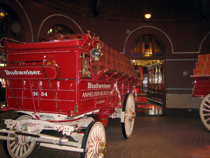 a red fire truck on display at a museum