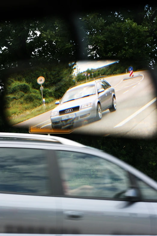 two cars are parked on the side of the street